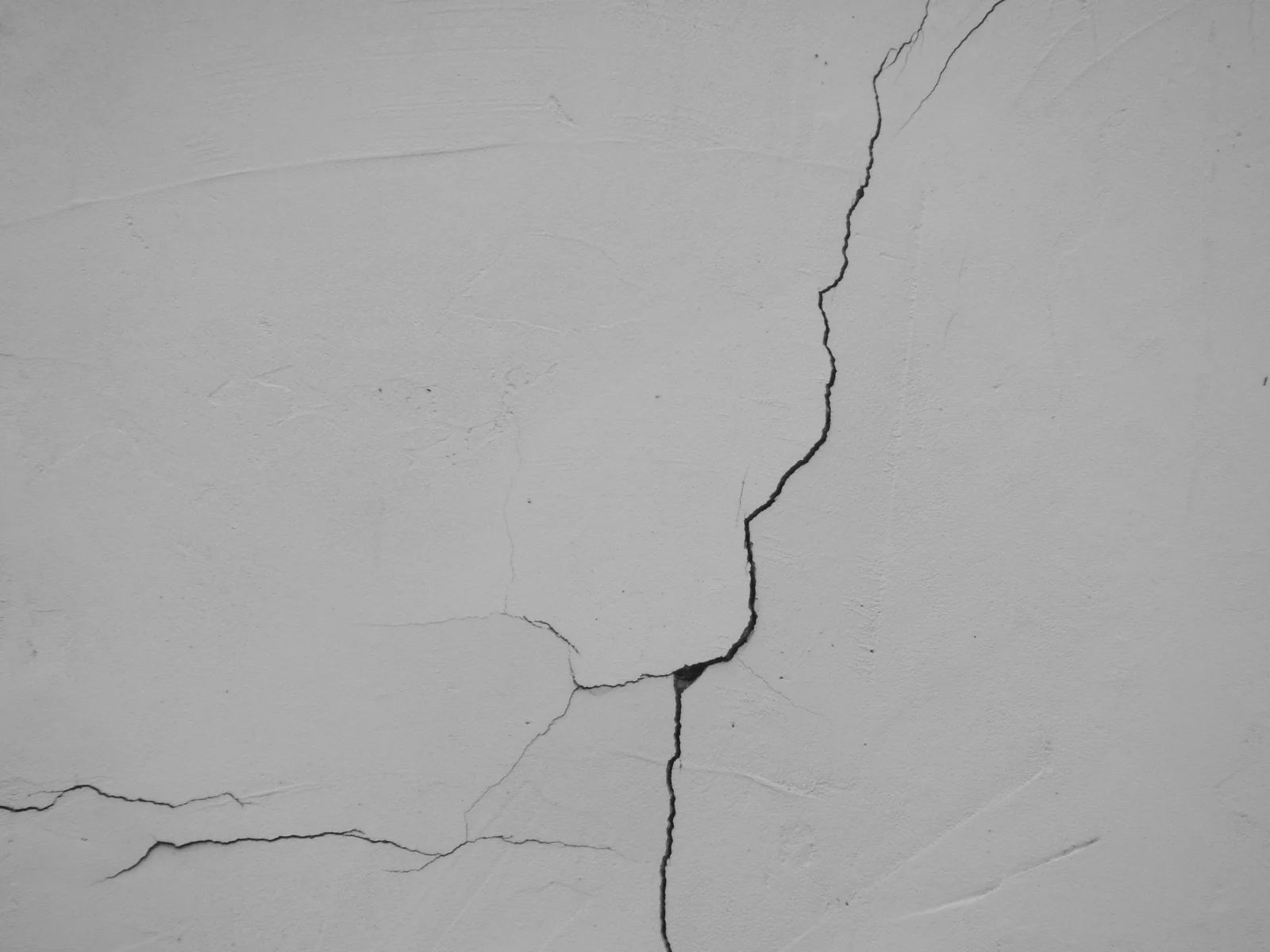 Cracked concrete foundation wall on residential structure