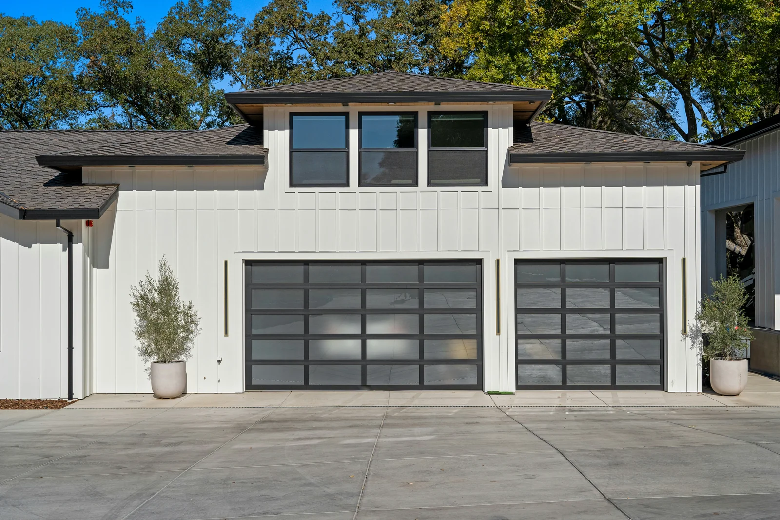 Suburban home with modern garage doors and driveway