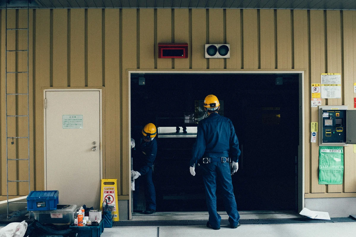 Garage door installer fitting overhead door